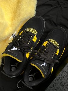 aj4 black yellow reps